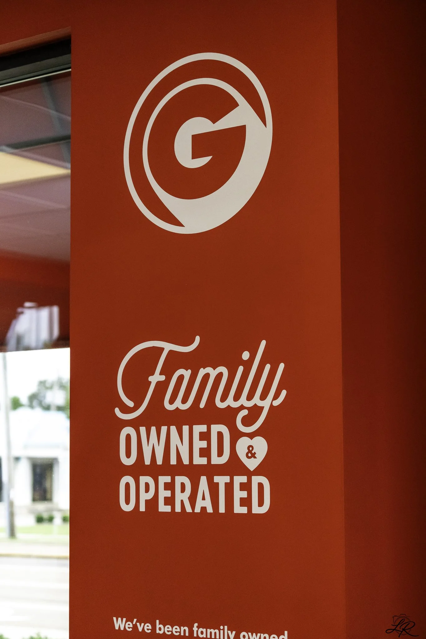 Sign with the text 'Family Owned & Operated' on a red background.
