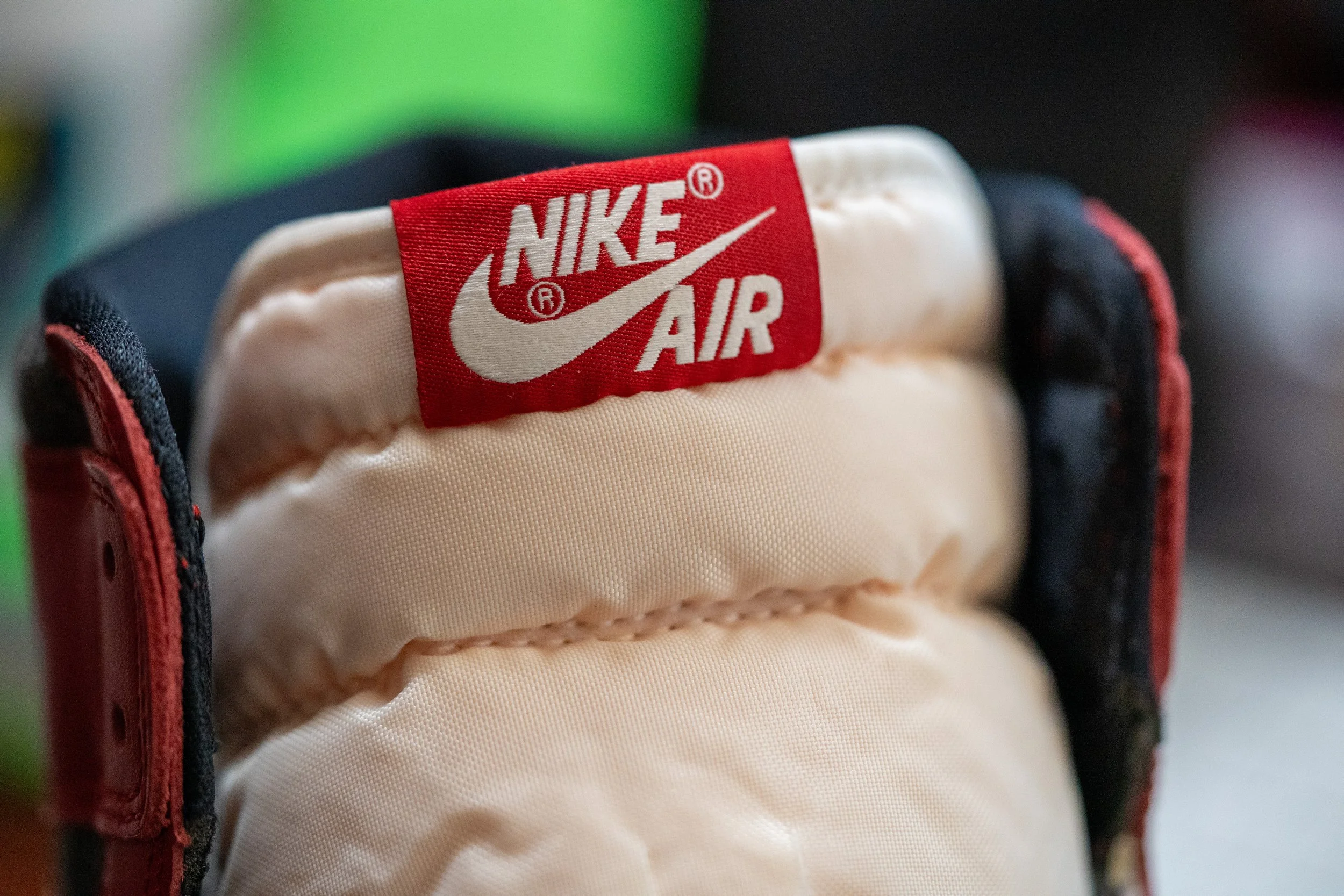 Close-up of the tongue of a Nike Air sneaker with a red Nike Air label.