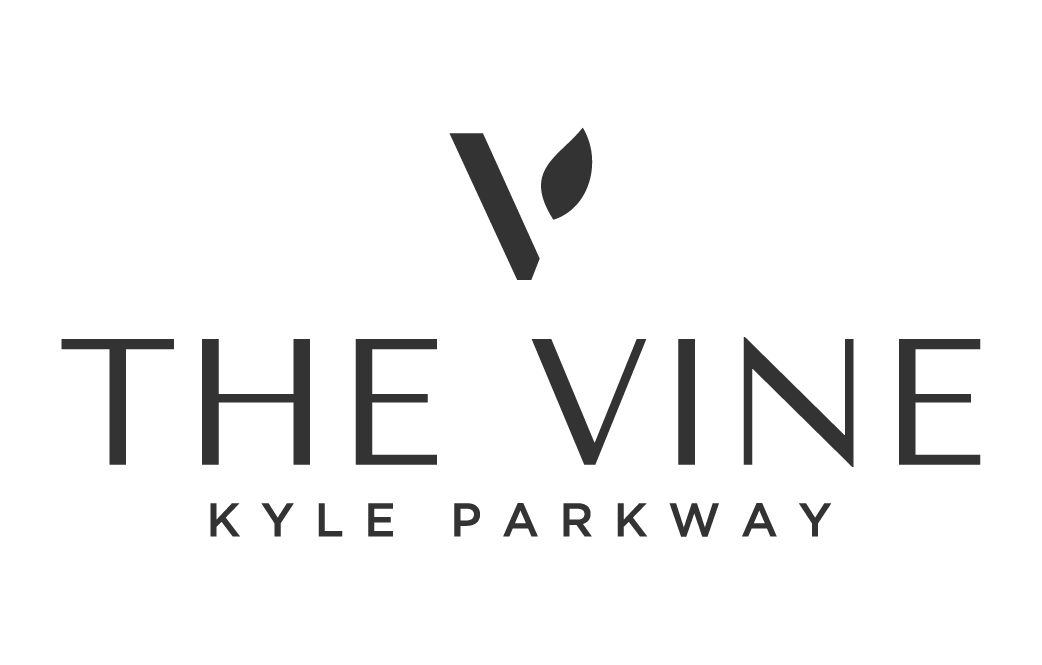Logo for The Vine Kyle Parkway with a stylized leaf and vine above the text.