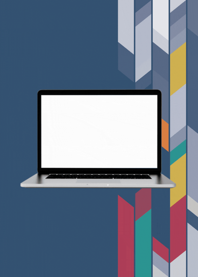 Laptop with blank screen placed over a white table against a blue wall with a colorful geometric mural.