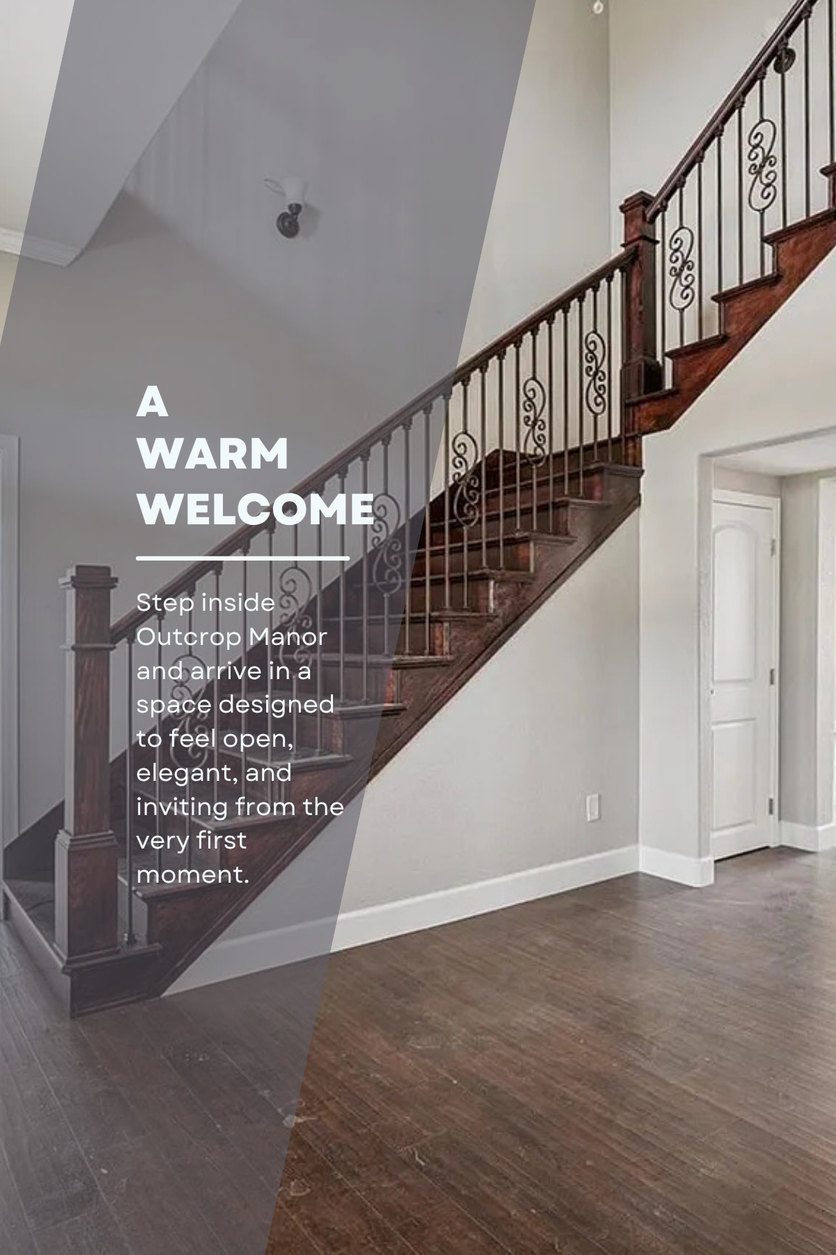 Interior view of a staircase with wooden steps and decorative metal railing in a modern home. There are white walls, a door at the bottom of the staircase, and hardwood flooring.