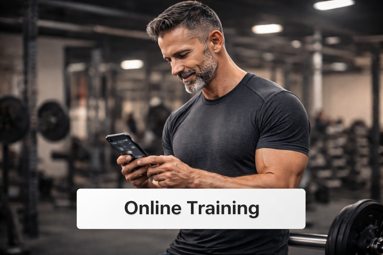 Man over 40 using phone in gym representing applying for online fitness coaching