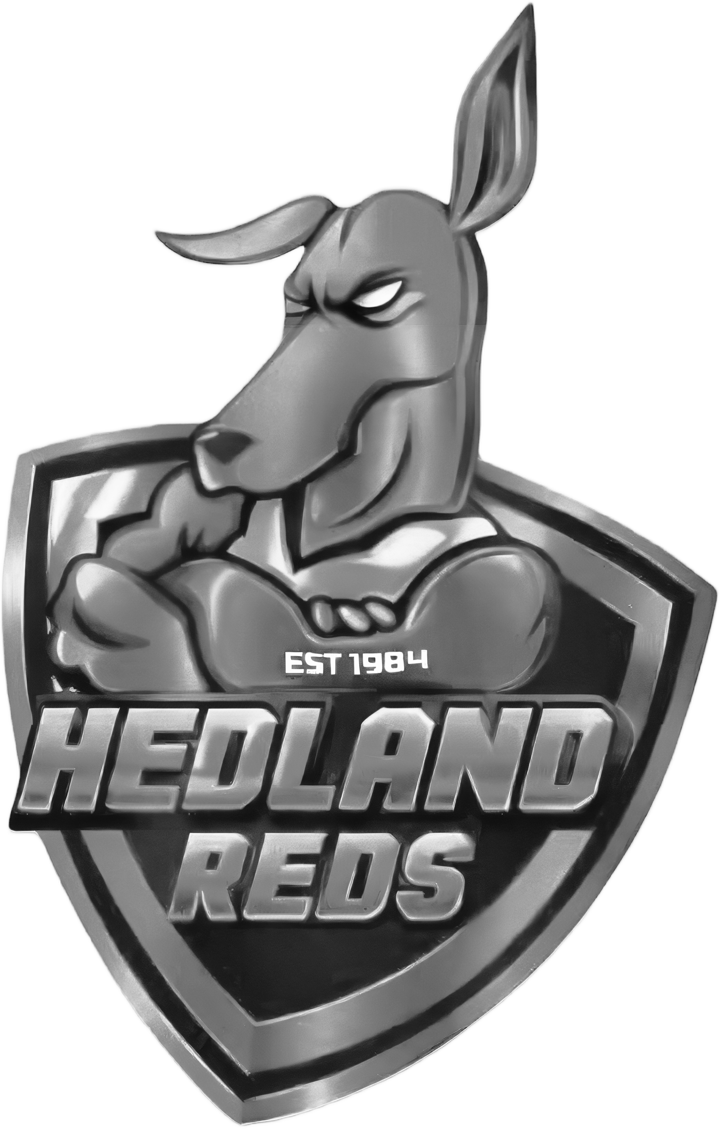 A black and white emblem featuring a muscular anthropomorphic rabbit with an angry expression, crossing his arms. The emblem includes the text 'Established 1984' and 'Hedland Reds'.