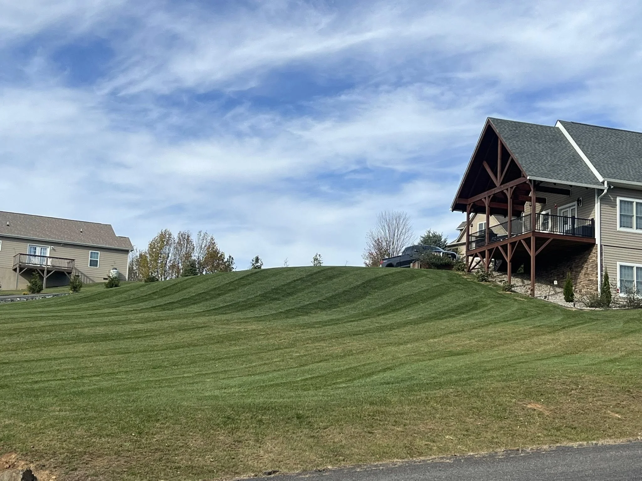 Professional lawn care services in Ashe County and Watauga County to improve soil health, reduce compaction, and promote thicker, healthier grass growth.