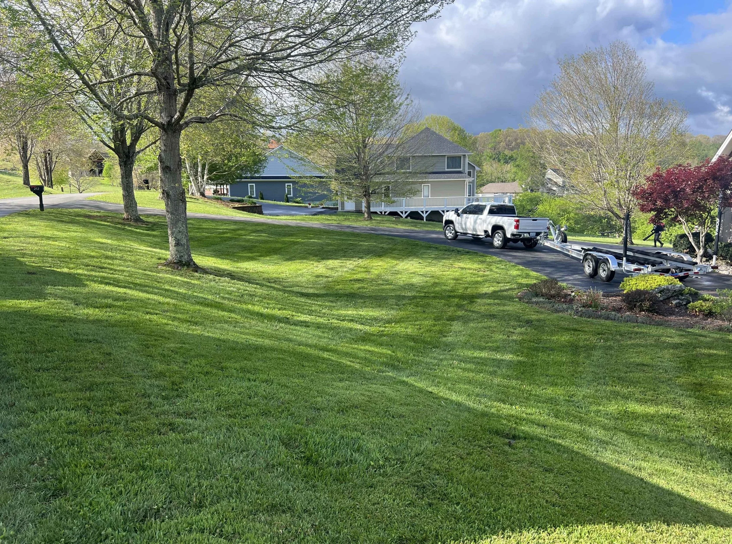 Seasonal lawn maintenance plans including mowing, trimming, edging, and lawn care treatments in Ashe County and Watauga County by Shape Up Lawn Care.