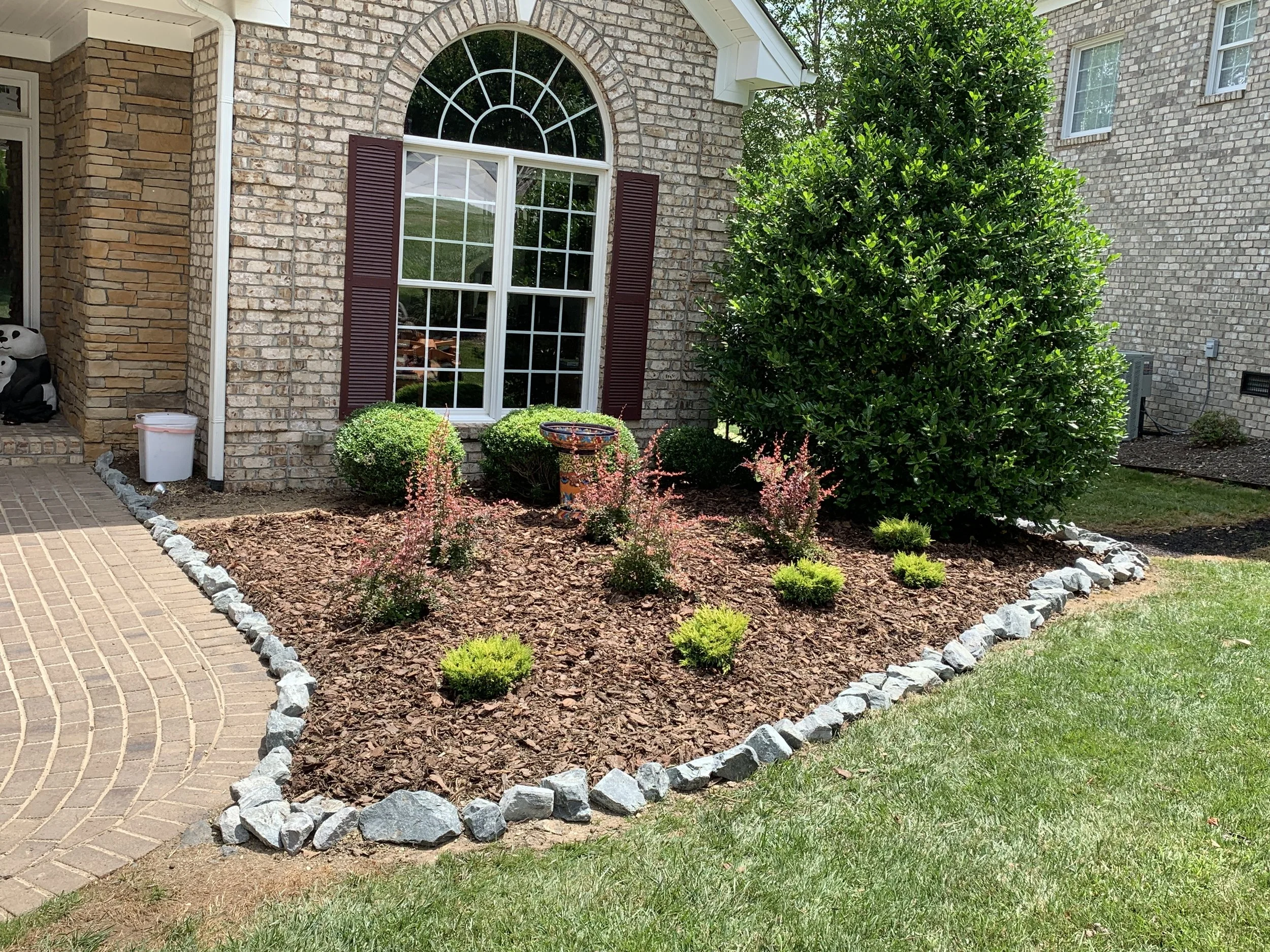 Mulching and flower bed maintenance services in Ashe County and Watauga County to keep landscape beds clean, healthy, and weed free.