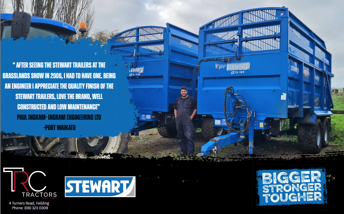 Two large blue Stewart trailers attached to a tractor, with a man standing in front of them, outdoors on a cloudy day.