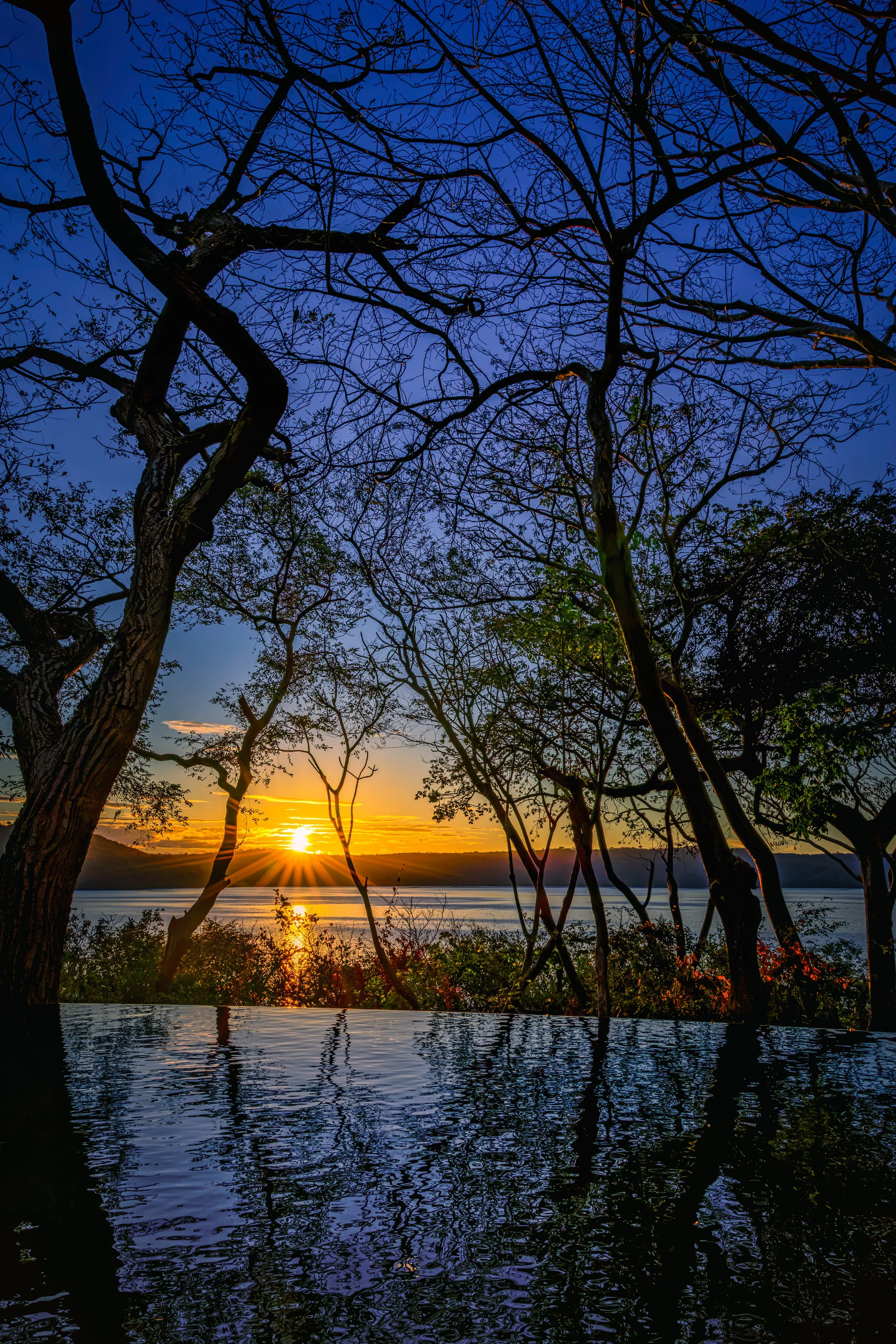 Infinity pool overlooking sunrise, Papagayo Peninsula, Costa Rica