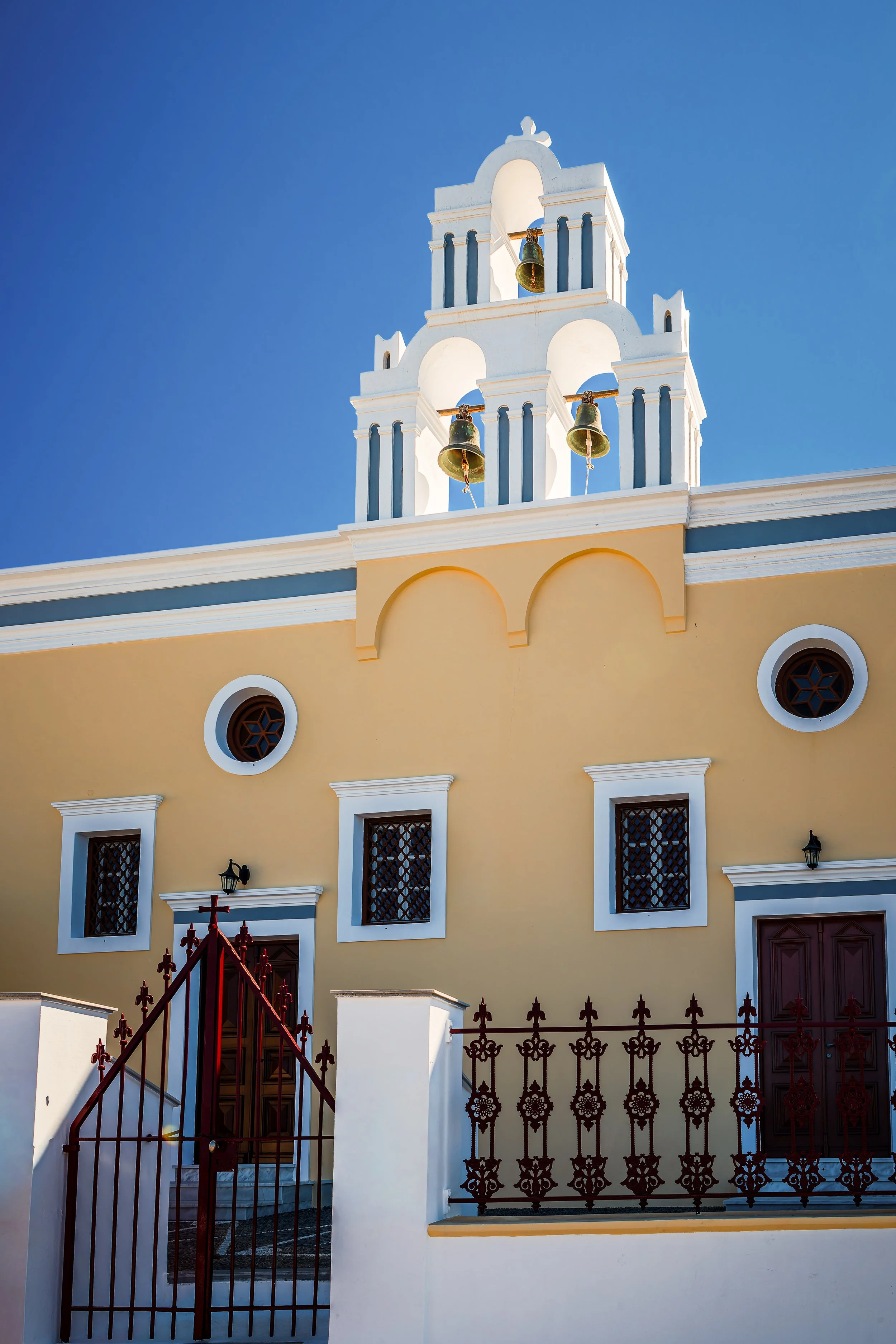 Yellow church with bell tower, Fira, Santorini, Greece