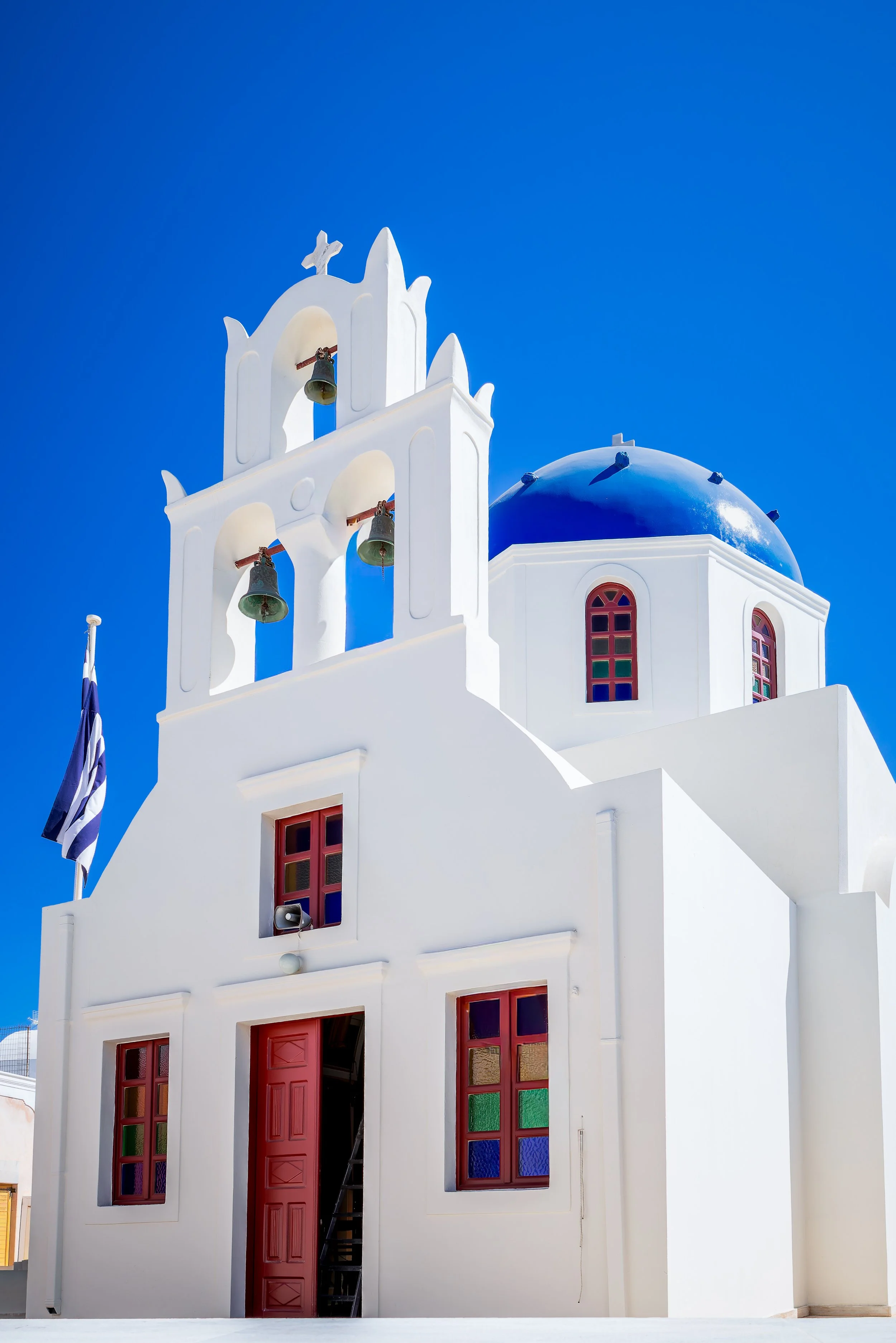 White church with blue dome and bell tower, Oia, Santorini, Greece