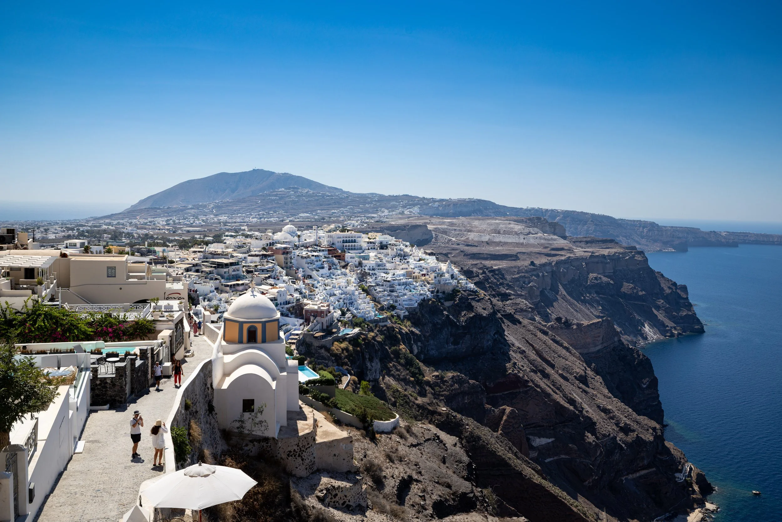 Fira Cliffside Path and Chapel Overlooking Santorini Caldera