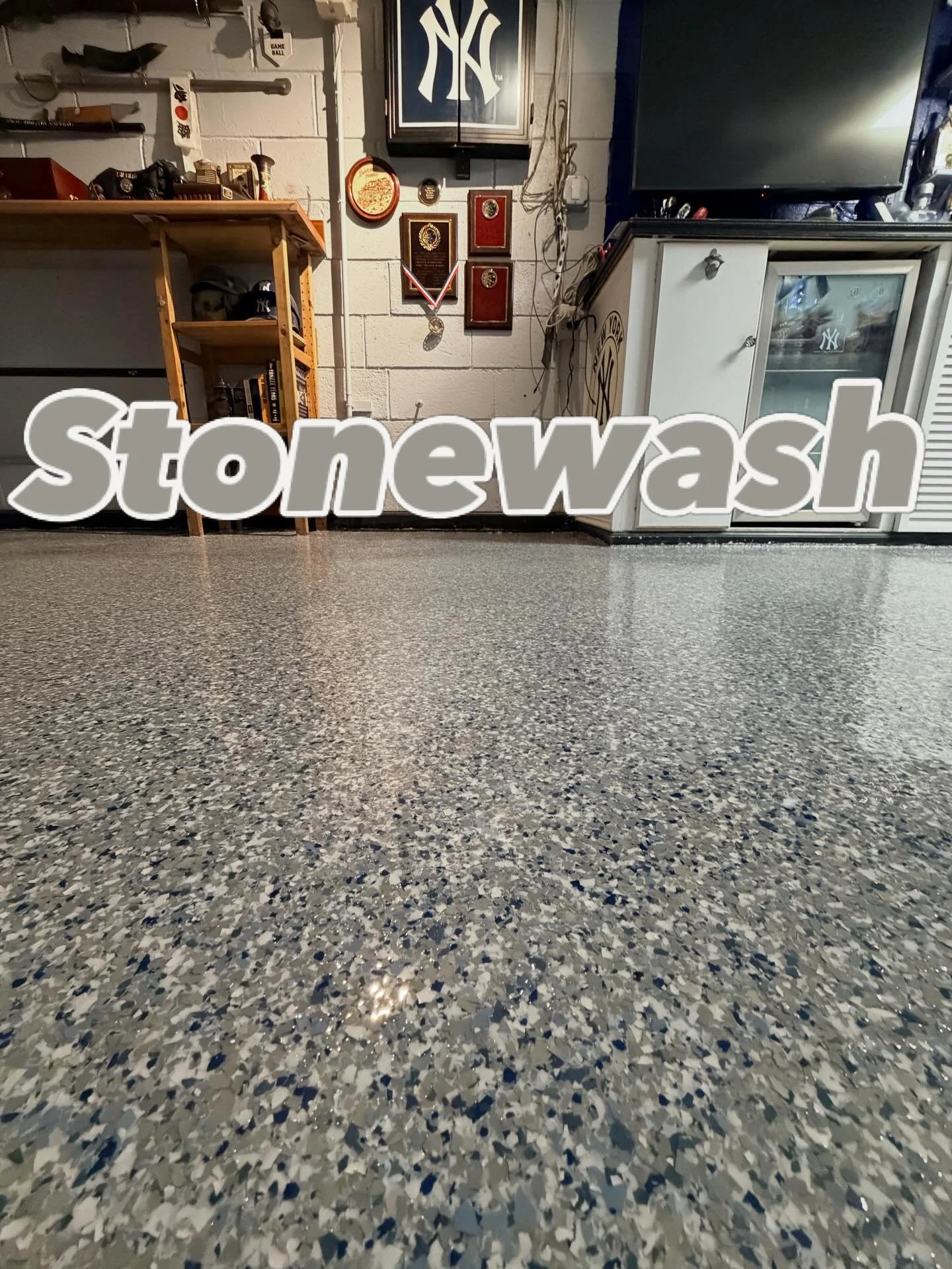 You think this customer is a @yankees fan?? I think so!! These decorative flakes should be renamed. Turned this beat up man cave into an inviting man&rsquo;s cave! Check out that color scheme!! #simiron polyaspartic flake system for this transformati