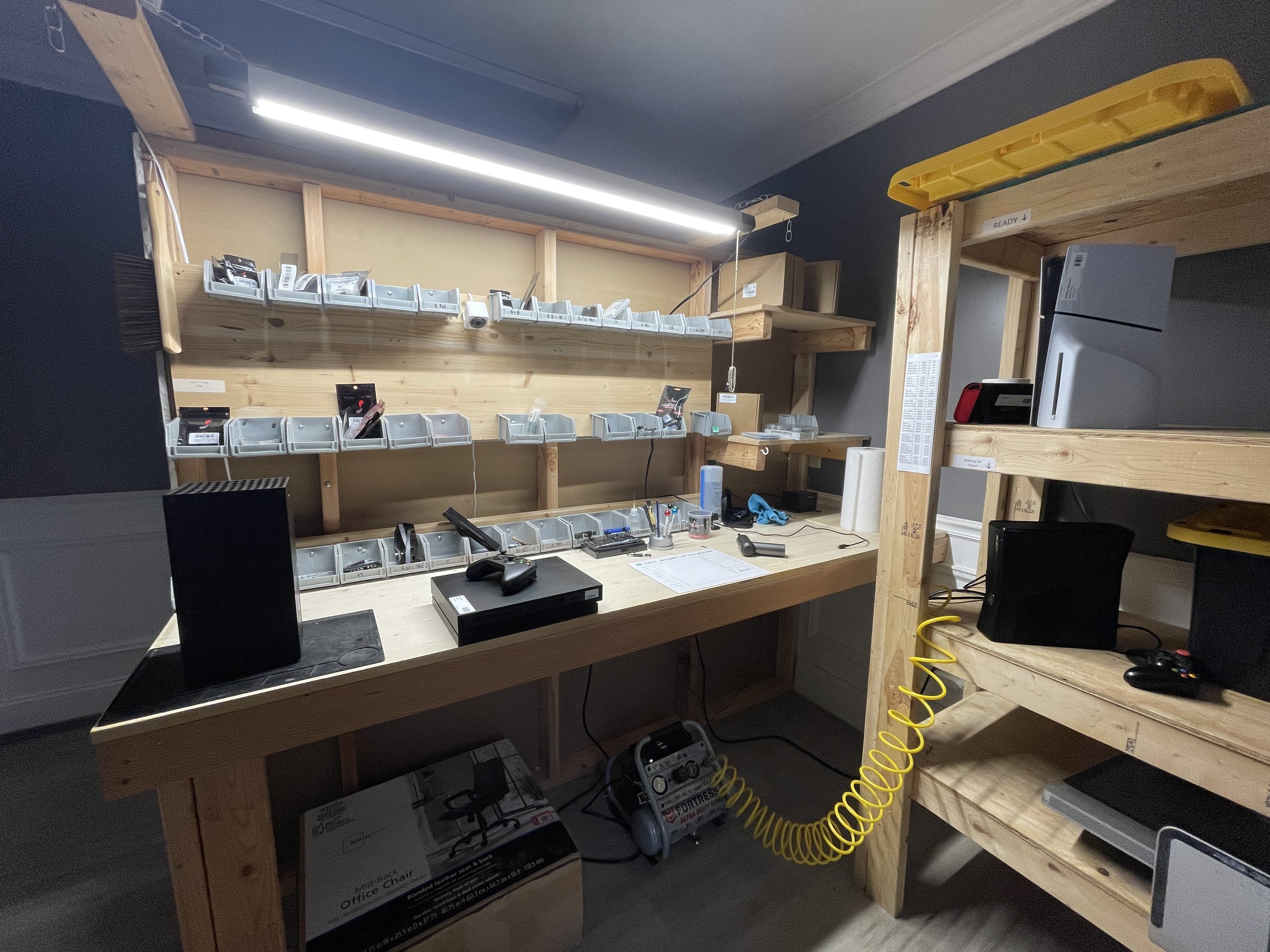 Dedicated game console repair room at newAGAIN in Salisbury NC — PS5, Xbox, Switch parts and bench