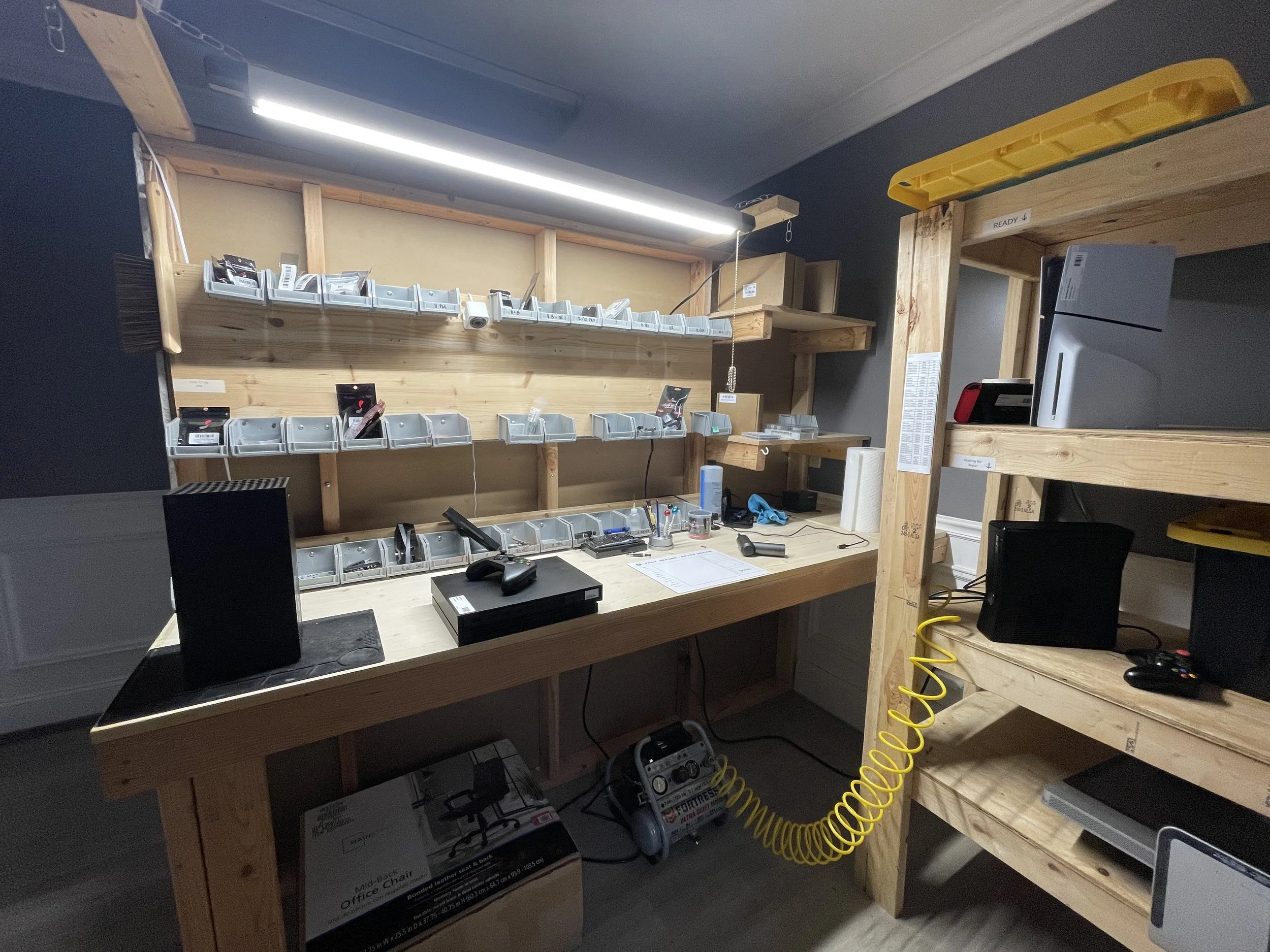Dedicated game console repair room at newAGAIN Phone Repair Salisbury — PS5, Xbox, and Nintendo Switch