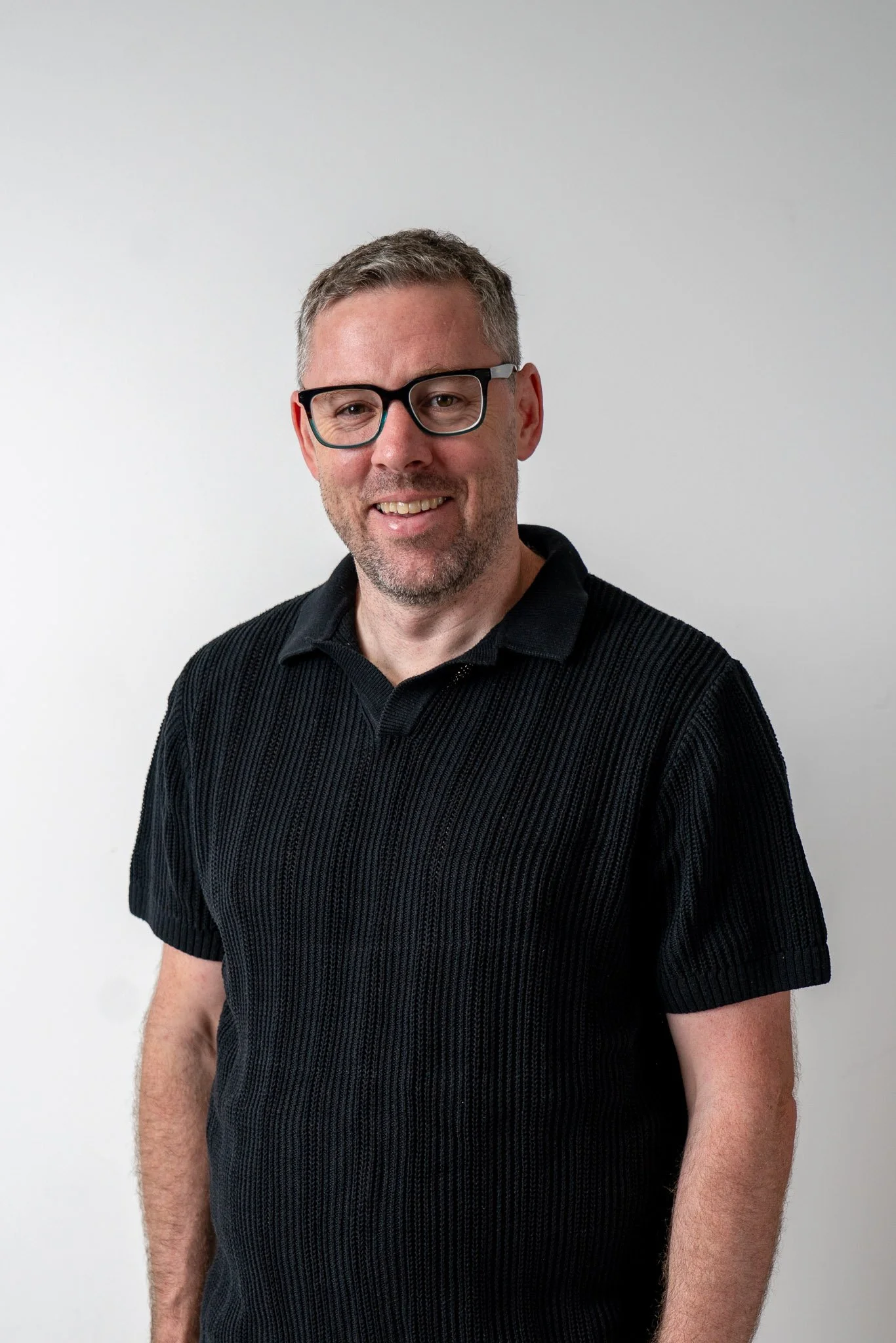 Aidan Neville, Founder of LMBD, standing against a plain white background.