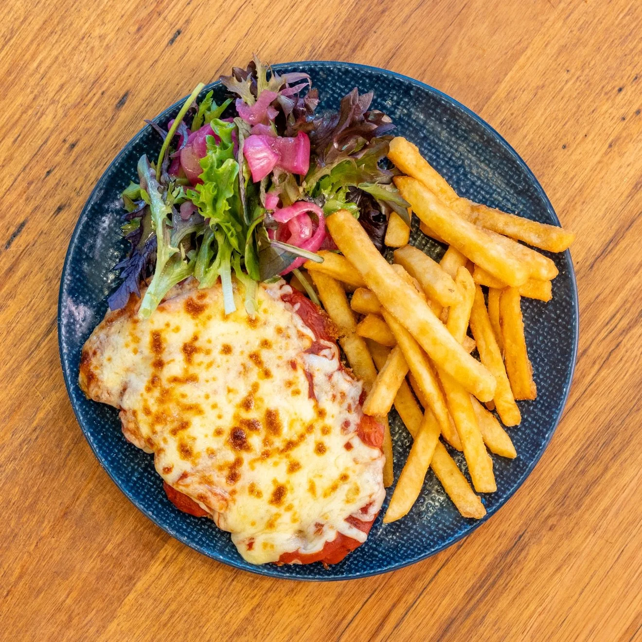 Tuesday nights are Parma Nights at Hampton Hotel!

Dine on our classic pub-style chicken parma with tomato sugo, ham and melted mozzarella, served with crispy chips and salad, all for just $20.

Start with Happy Hour from 3-6pm, then settle in for an
