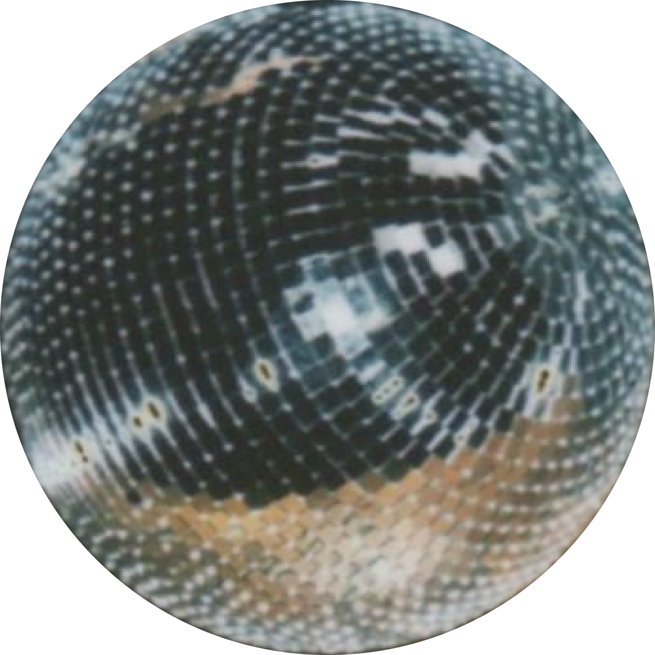Close-up of a disco ball reflecting light and surrounding environment.