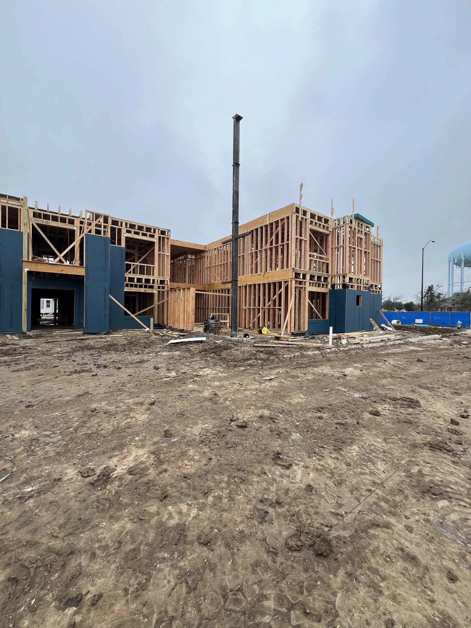 Structural metal support beam installation in a newly constructed apartment complex in the Dallas-Fort Worth (DFW) area. Precision-fabricated steel beam providing critical load-bearing support for modern multifamily construction. Expert metal fabrica