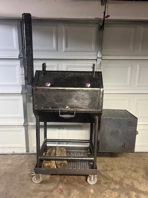 Custom offset smoker fabrication in Dallas–Fort Worth, TX, built from heavy-duty steel for serious BBQ performance and long-lasting durability. This handcrafted smoker features a traditional offset firebox design, mounted on a mobile steel frame with