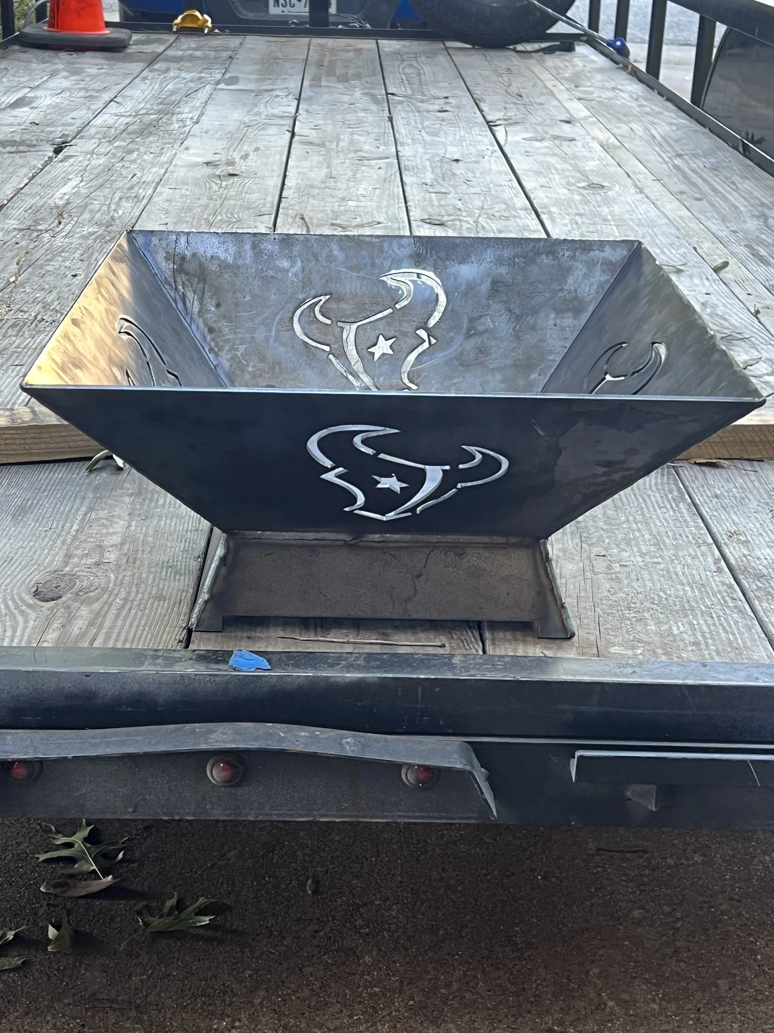 Custom fully welded steel fire pit featuring a CNC plasma-cut Houston Texans logo, proudly built in Texas for true Texans fans. Heavy-duty construction designed for durability, outdoor performance, and long-lasting use. Precision metal fabrication wi