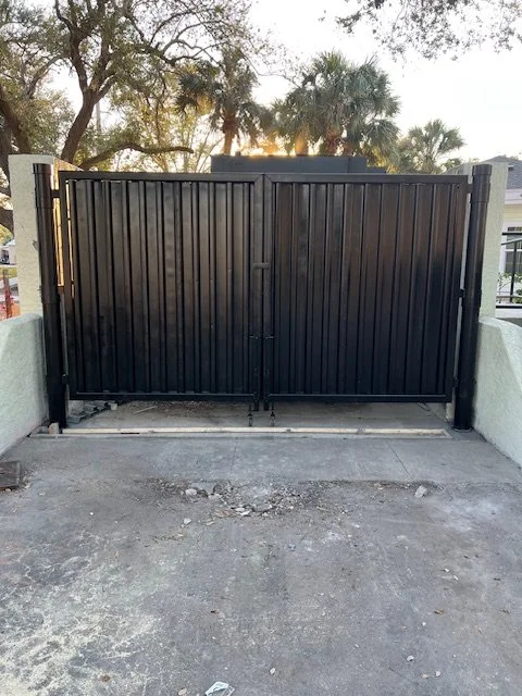 Secure dumpster enclosures fabricated with reinforced steel panels and lockable access to prevent unauthorized use and improve site safety