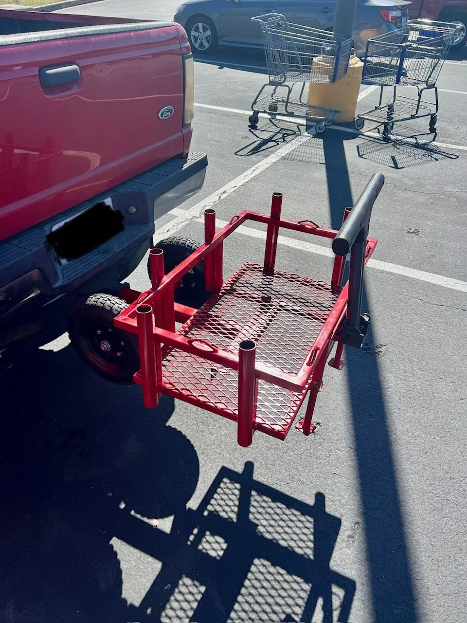 Custom truck hitch-mounted cooler cart with integrated fishing rod holders, ergonomic handle, and heavy-duty wheels for easy transport. Designed for quick attachment and removal, this versatile cart is perfect for lake days, beach trips, and outdoor 