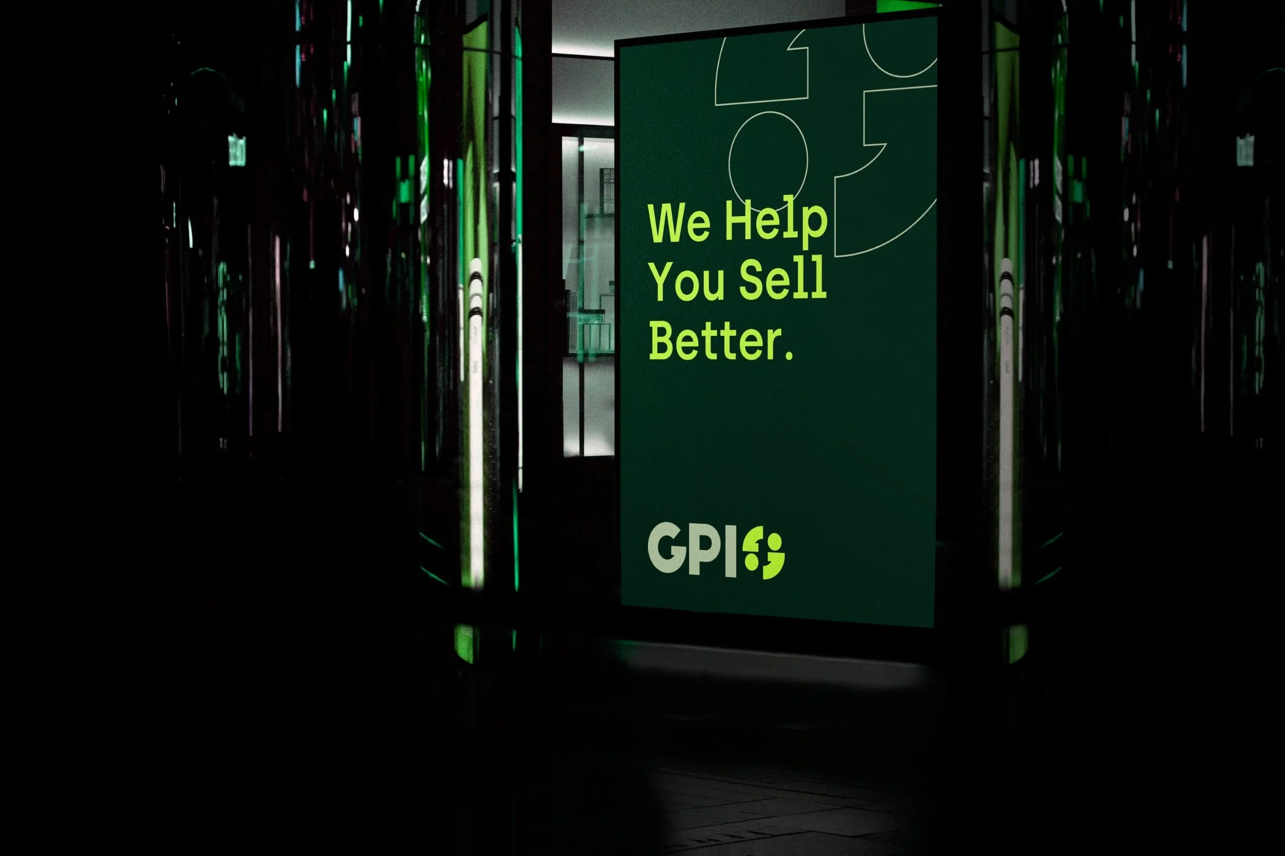 A neon sign with the words 'We Help You Sell Better.' and the logo 'GPI' at the bottom, displayed in a dark interior setting with reflective surfaces.