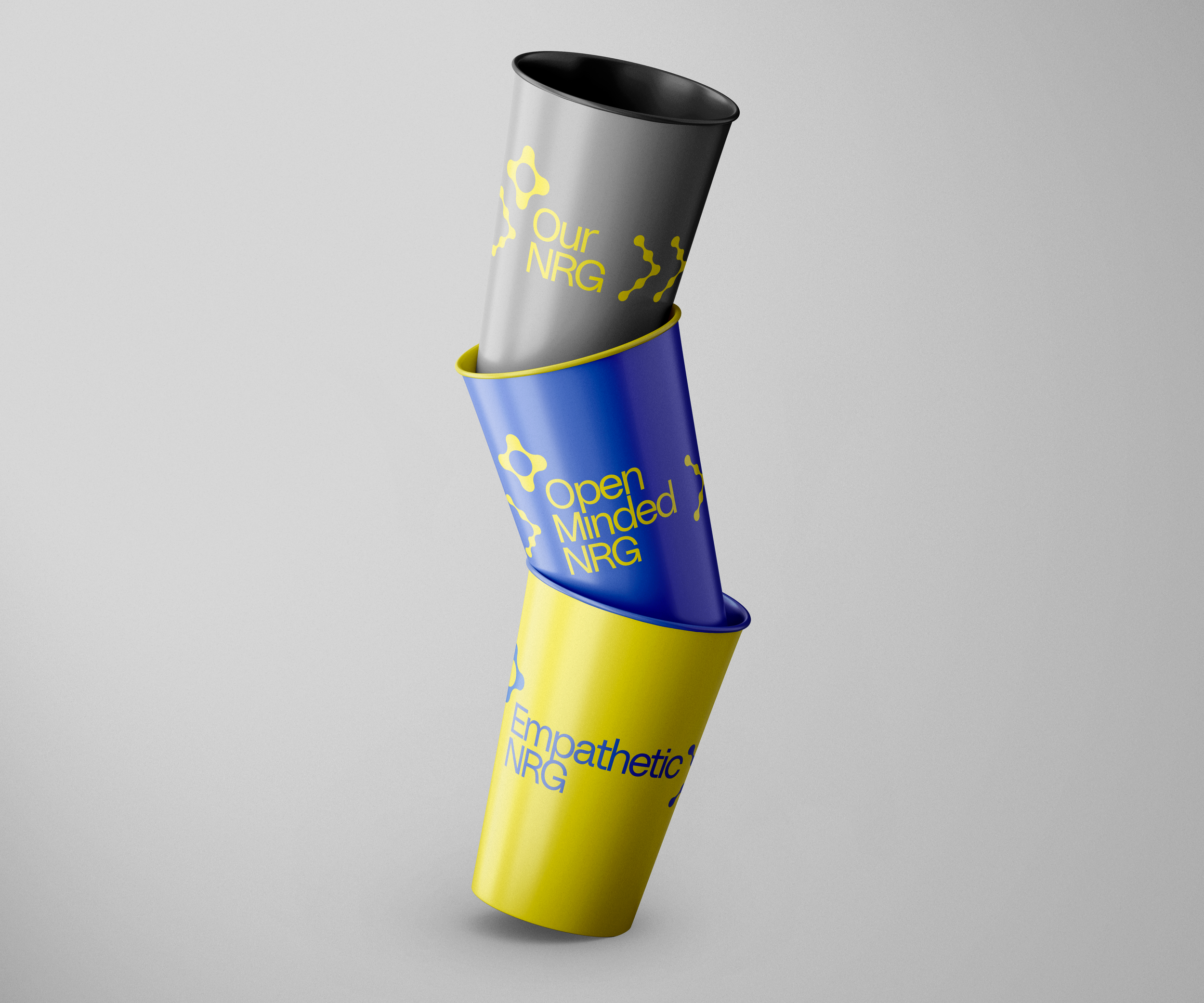Three cups stacked vertically labeled "Our NRG," "Open Minded NRG," and "Empathetic NRG" with a gray background.
