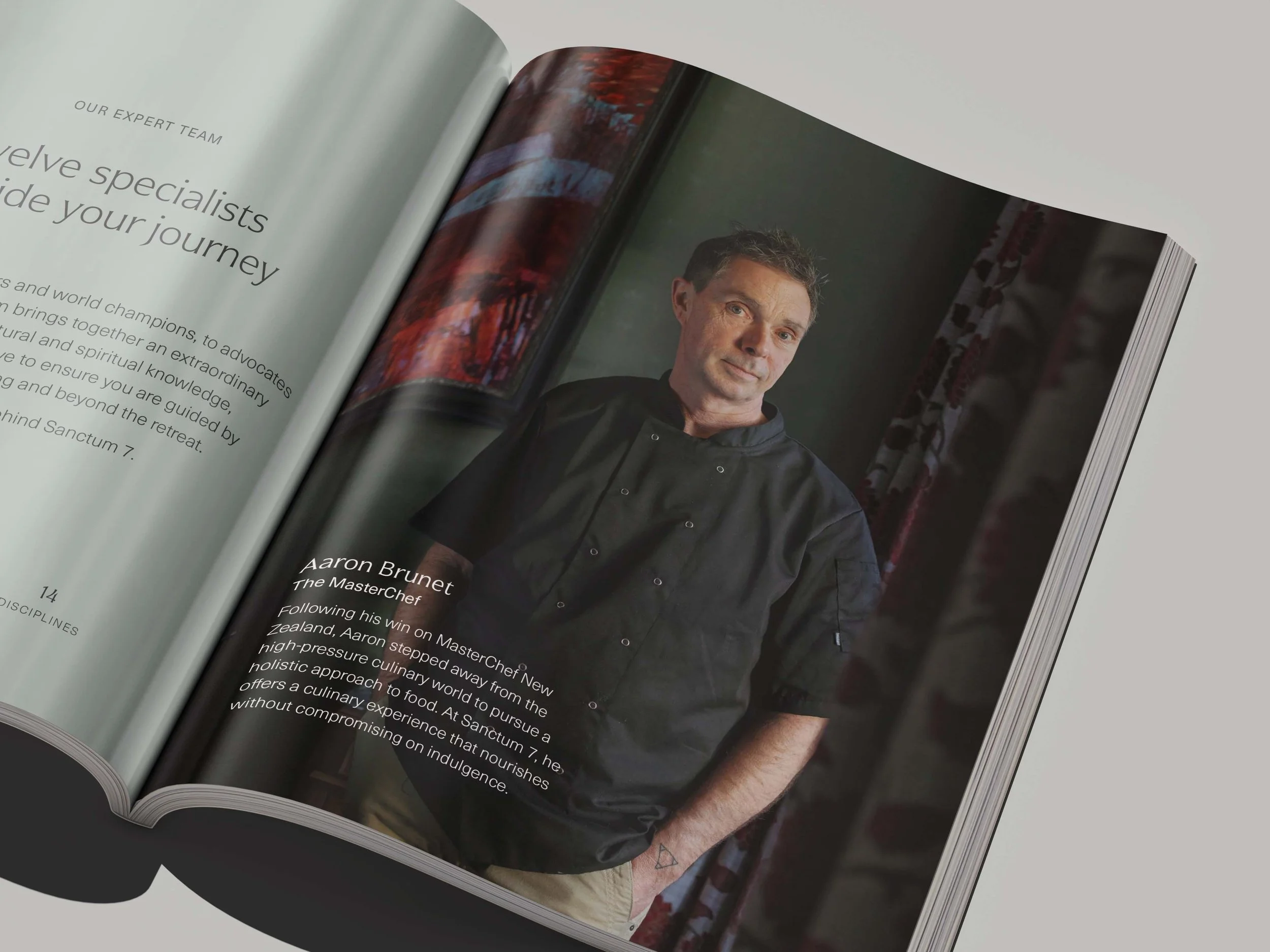 Open magazine showing a page with text and a portrait photo of a man in a chef's coat.