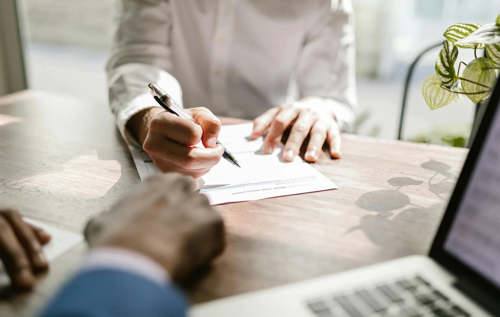 real-estate-contracts-being-negotiated-on-the-table.jpg