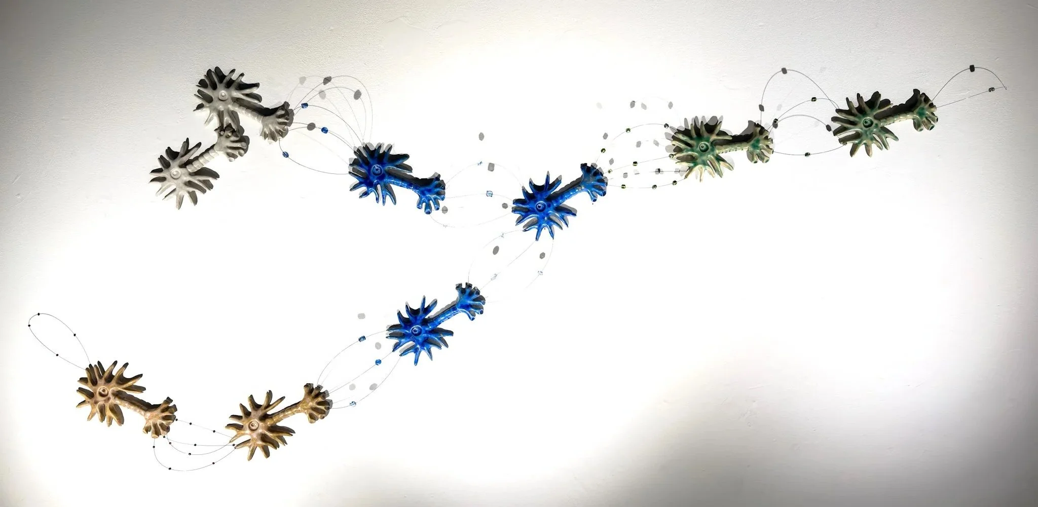 Neuromodulation, 2026, Ceramic, music wire, glass and ceramic beads, H29”xW76”xD3.5”