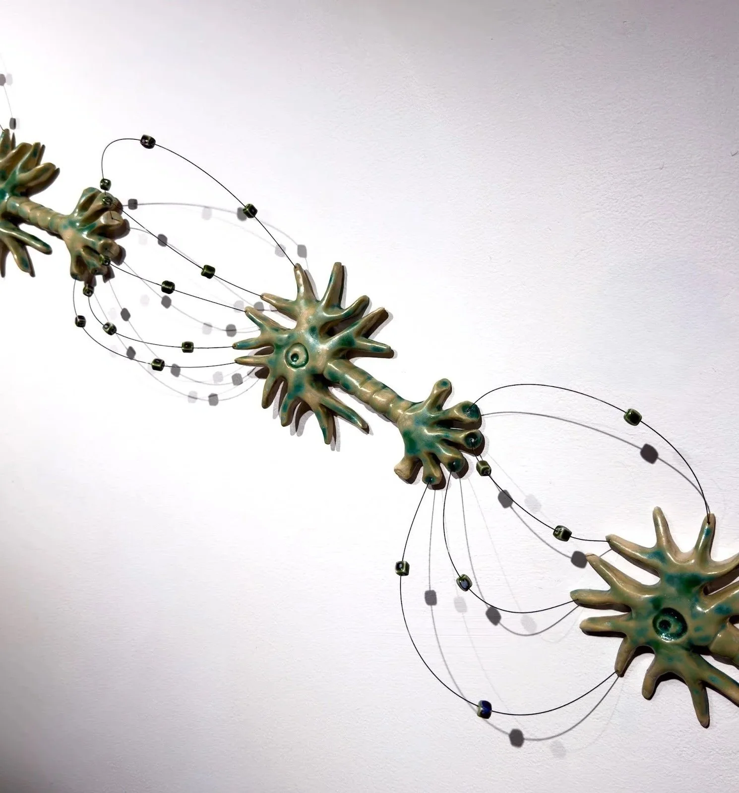 Inhibitory (detail), 2026
Ceramic, music wire, ceramic beads
H24”x W42”xD4”