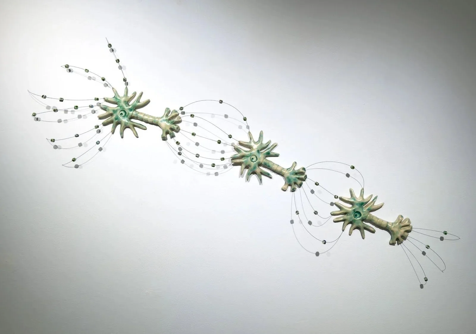 Inhibitory, 2026
Ceramic, music wire, ceramic beads
H24”x W42”xD4”