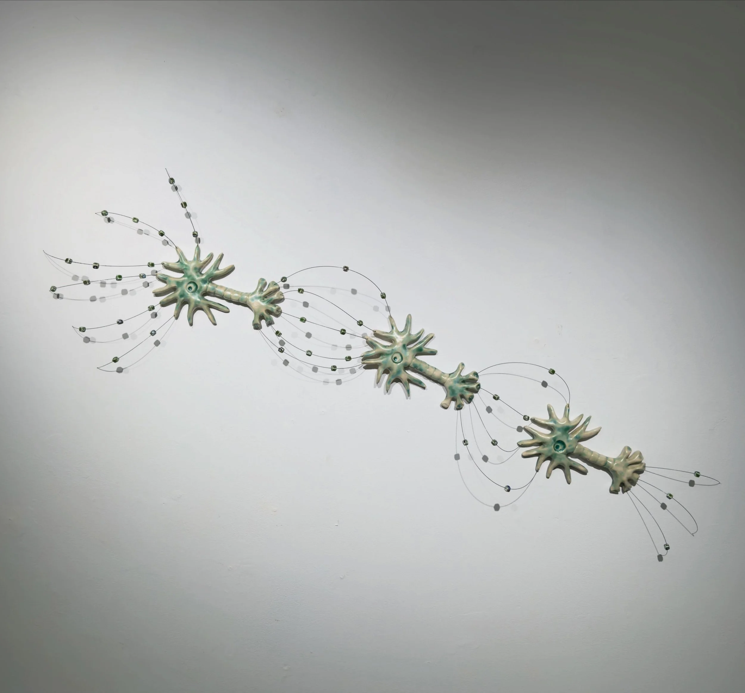 Inhibitory, 2026
Ceramic, music wire, ceramic beads
H24&rdquo;x W42&rdquo;xD4&rdquo;