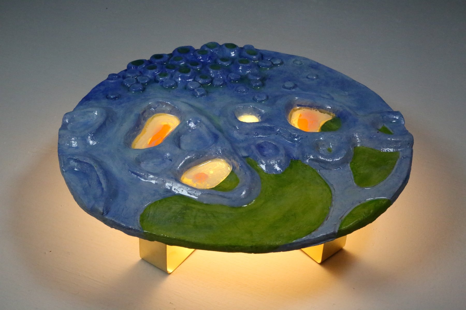 Vesicles and Vacuoles
(from the Microscopic
Miracles Series)
2024
Ceramic, resin,
theatrical lighting
paper, brass, light
9x9x2.5