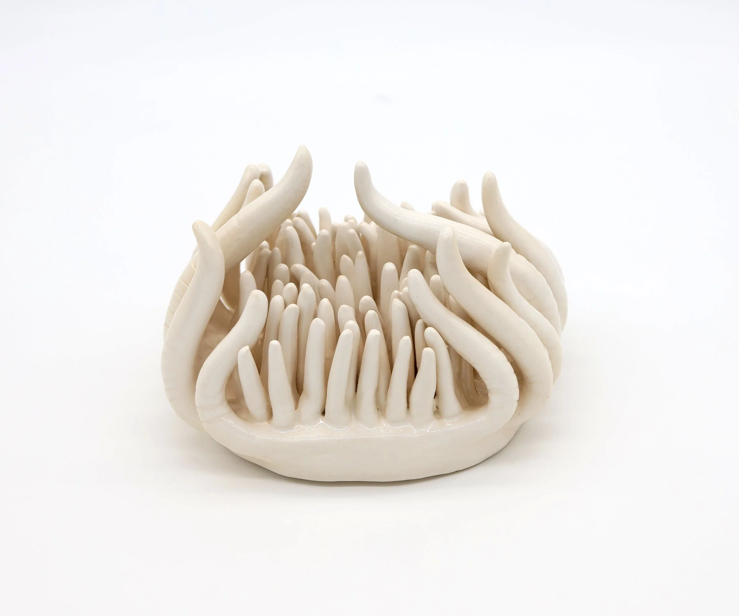 Holding Back,
Ceramic, 2023,
4.5” X 6.5” X 5” (H x W x D)