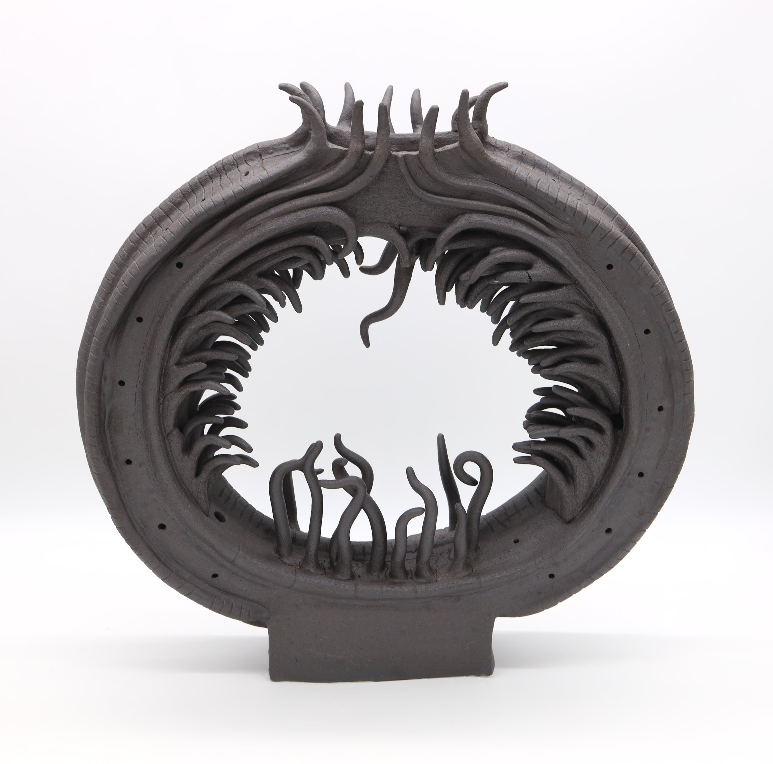 Samsara (Cycle of Birth and Death),
Ceramic, 2024
8” X 21” X 4” (H X W X D)