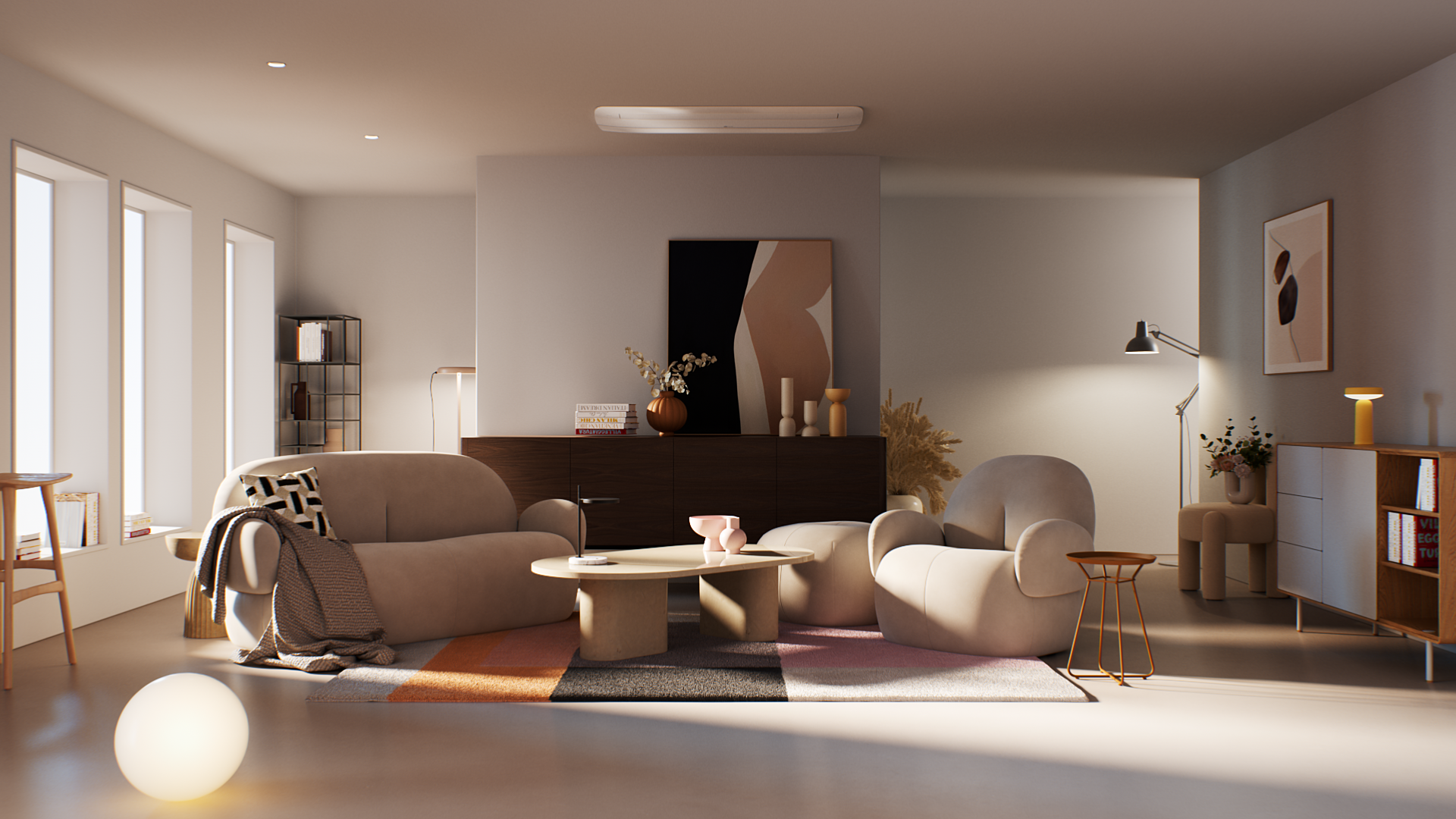 Living room with beige sofas, white armchair, modern coffee table, and a colorful rug. The room has decorative items like vases, books, lamps, and artwork, with natural light coming through window blinds.