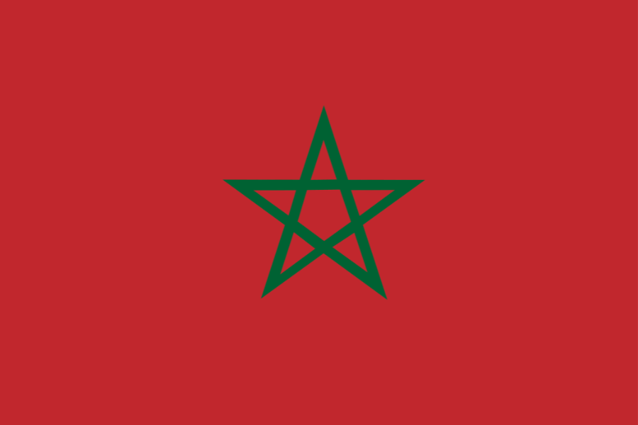 Moroccan flag with a red background and a green five-pointed star in the center.