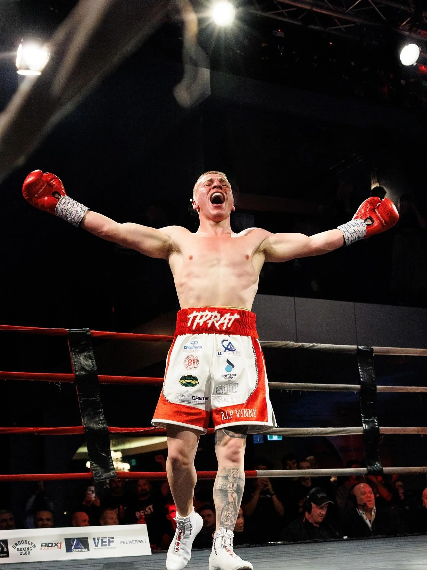 Jesse 'Tiprat' Bolt a professional fighter, fighting out of House of Stoush Boxing Academy, in the ring with arms outstretched and a triumphant expression after one of his professional fight KO wins.