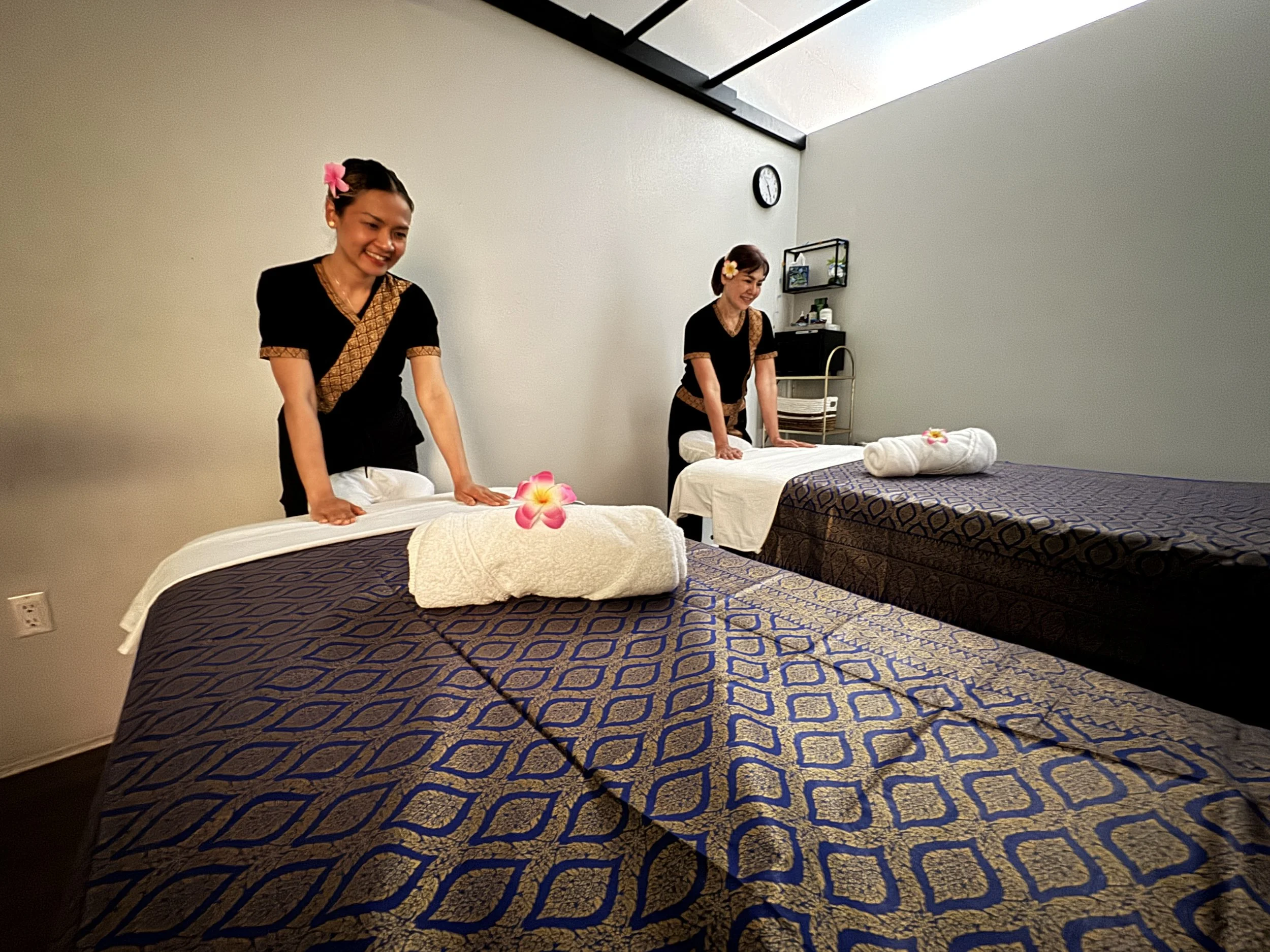 Rose and Nan set up couples massage beds in our clean and peaceful massage sanctuary interior located in East Kapolei