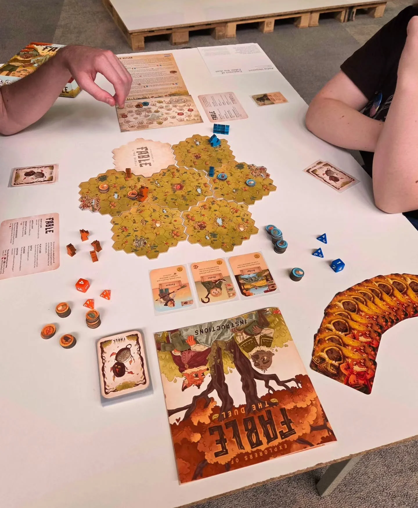 Explorers of Fable, the duel, is Aisha's graduation project ☀️

Compete to grow your settlement in this strategic, resource gathering boardgame for 2 players! Explore the unknown island of Fable and befriend it&rsquo;s local community, harvest deposi