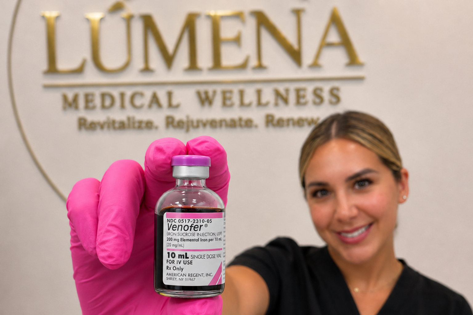 A woman smiling and holding a vial of Venofert iron supplement in front of a sign that reads 'LUMENA Medical Wellness.'