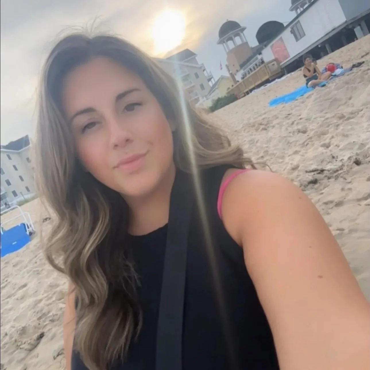 Winnie Lane & Co. owner and Maine wedding planner enjoying a sunset on a local beach.