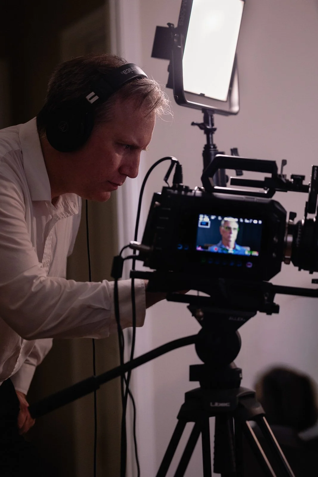camera operator adjusts gear