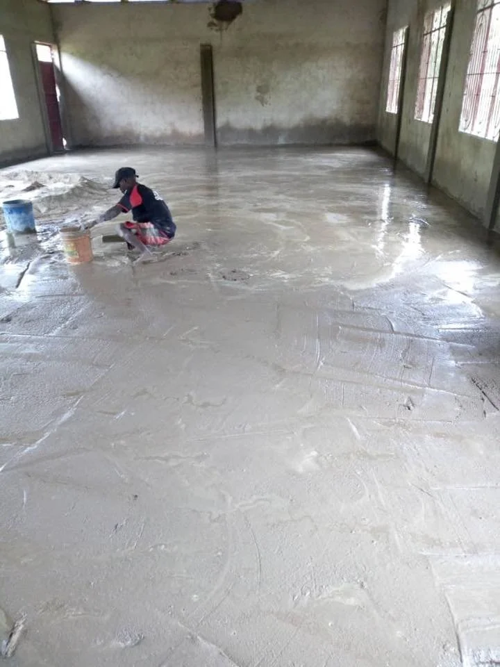 Finishing the floor of the dining hall.