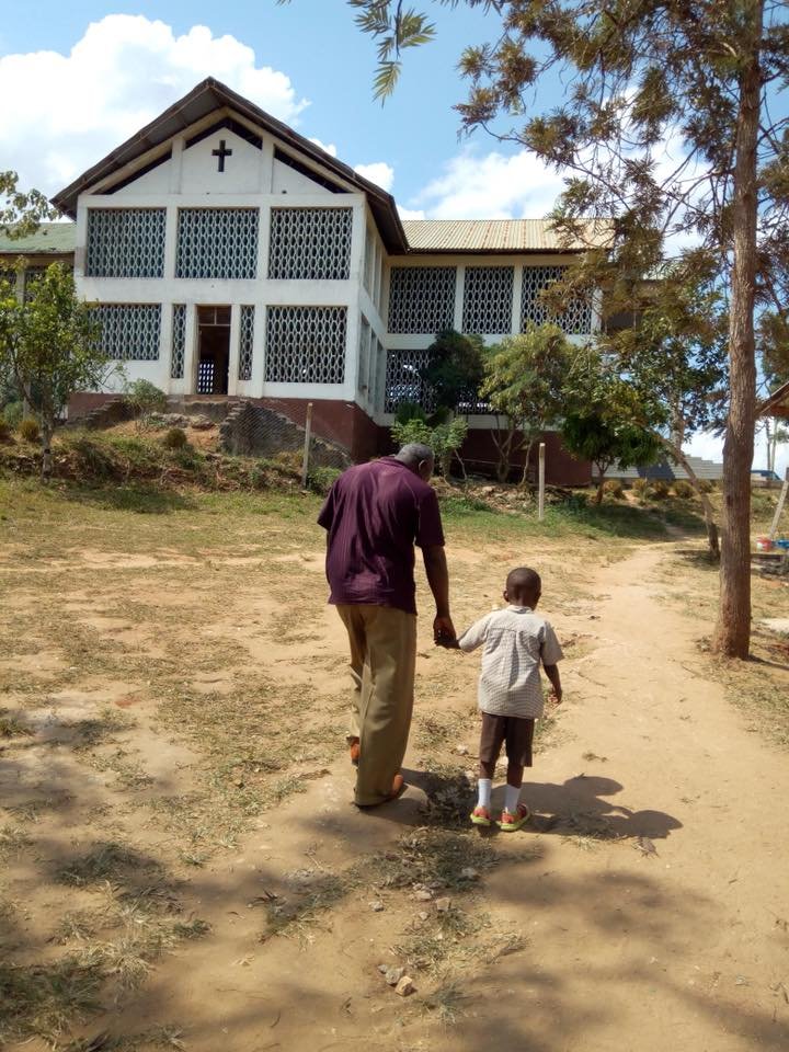 Bro. Livingstone walking with student.
