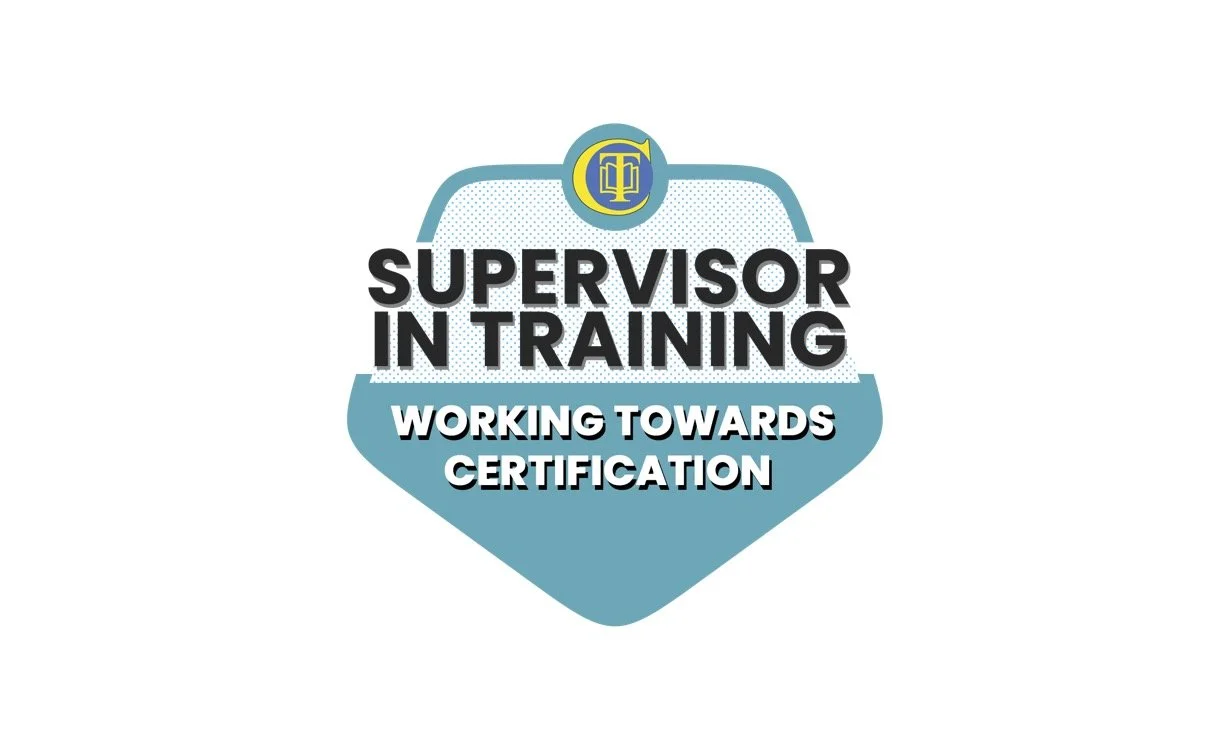 Logo for Supervisor in Training certification program, featuring a badge shape with blue and white colors, a circular emblem at the top, and the text 'Supervisor in Training' and 'Working Towards Certification'.