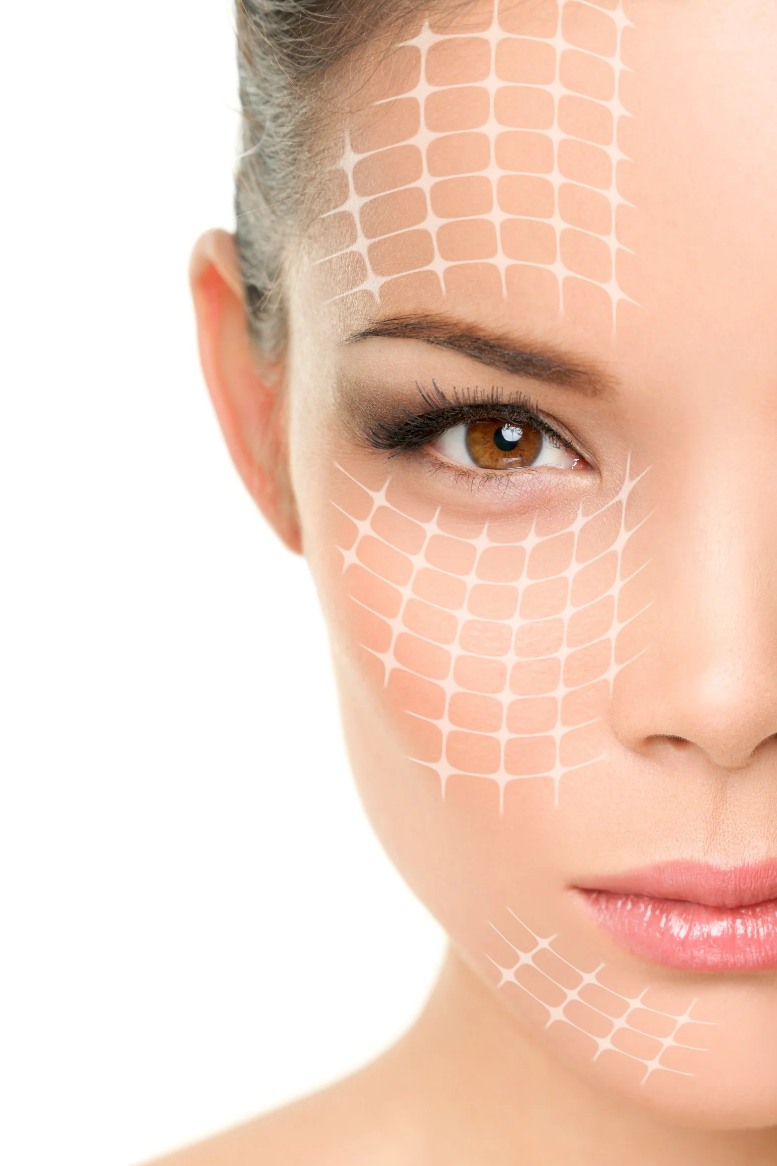 Close-up of a woman's face with digital grid overlay indicating skin analysis or cosmetic treatment.