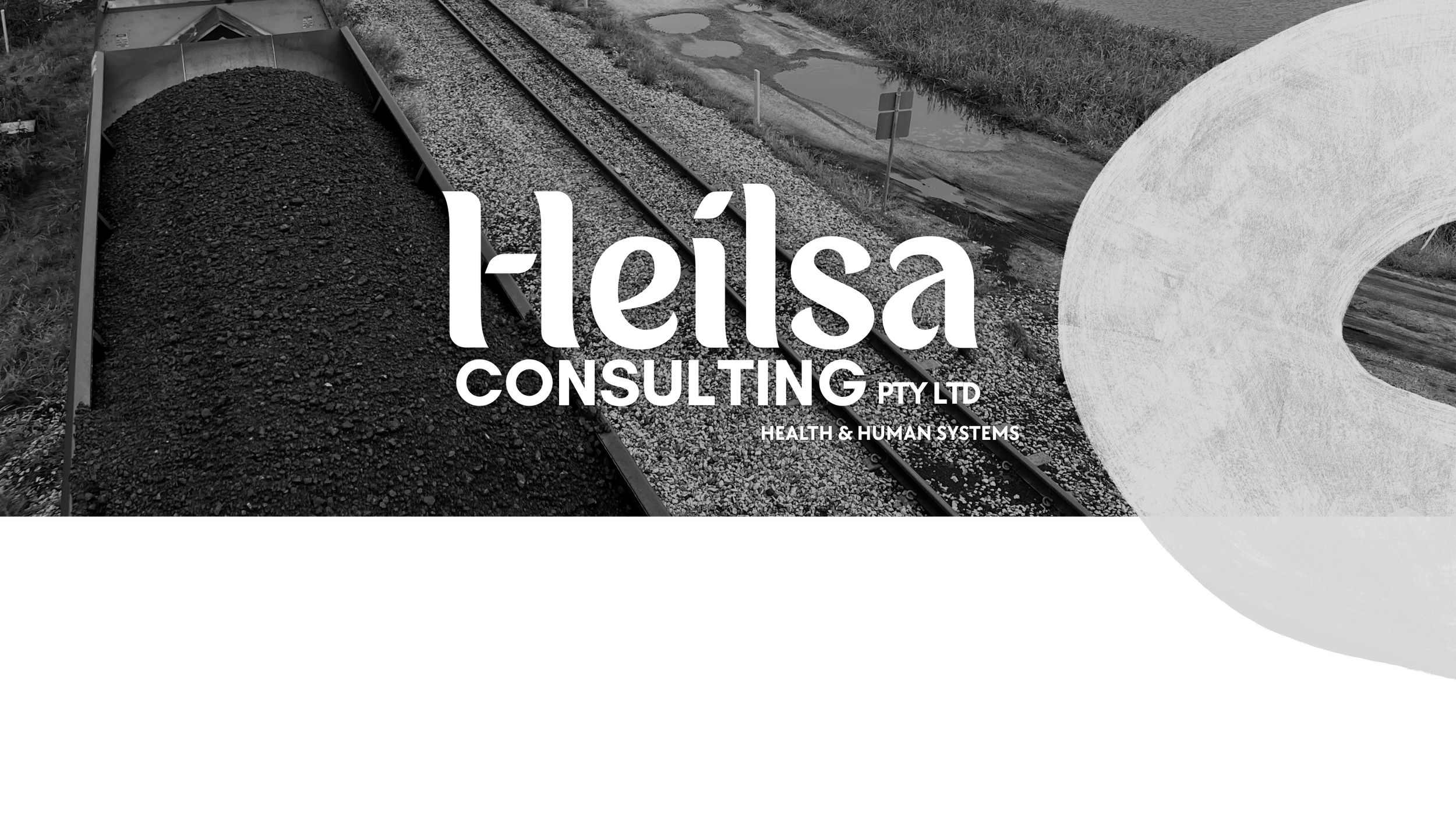 Black and white image with a train car filled with coal on railway tracks, alongside a large white abstract shape. Overlaid text reads 'Helesa Consulting Pty Ltd' and 'Health & Human Systems'.